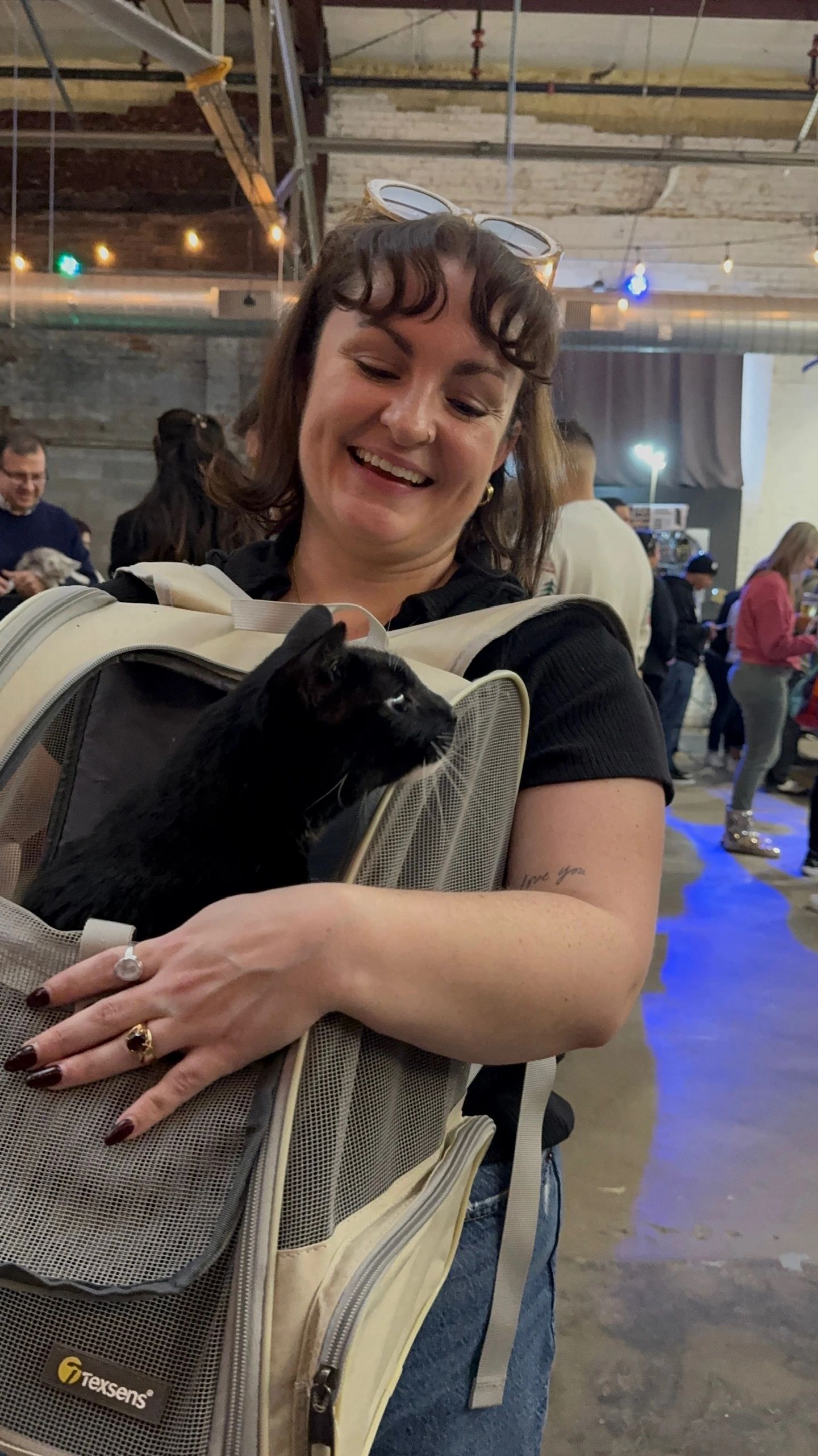 Attendee holding a kitten at the Houston Cat Expo